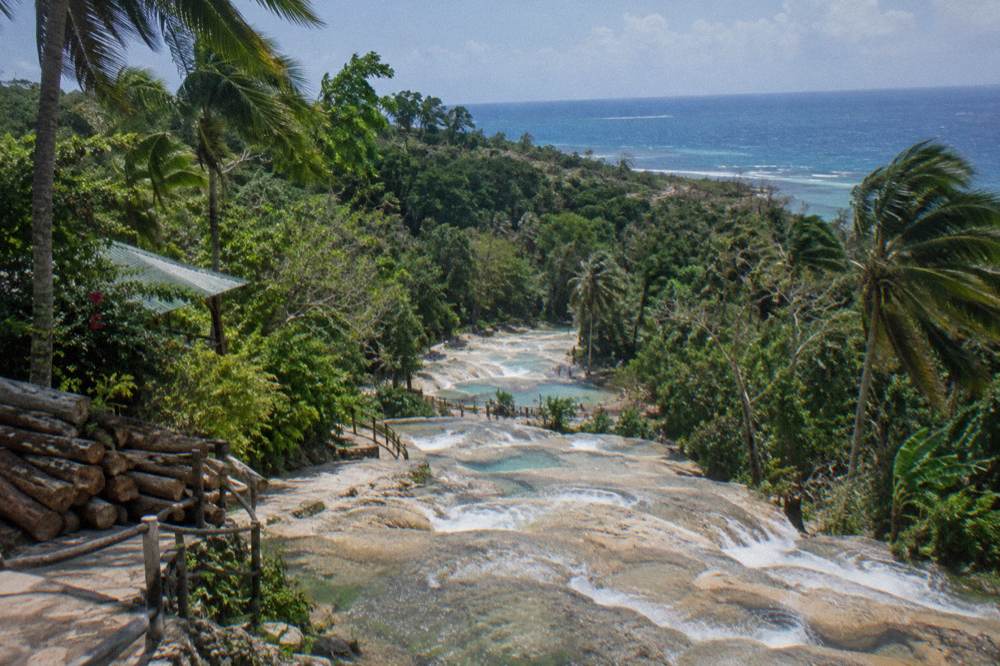 View across the waterfall terraces toward the Caribbean Sea from the top of the climb