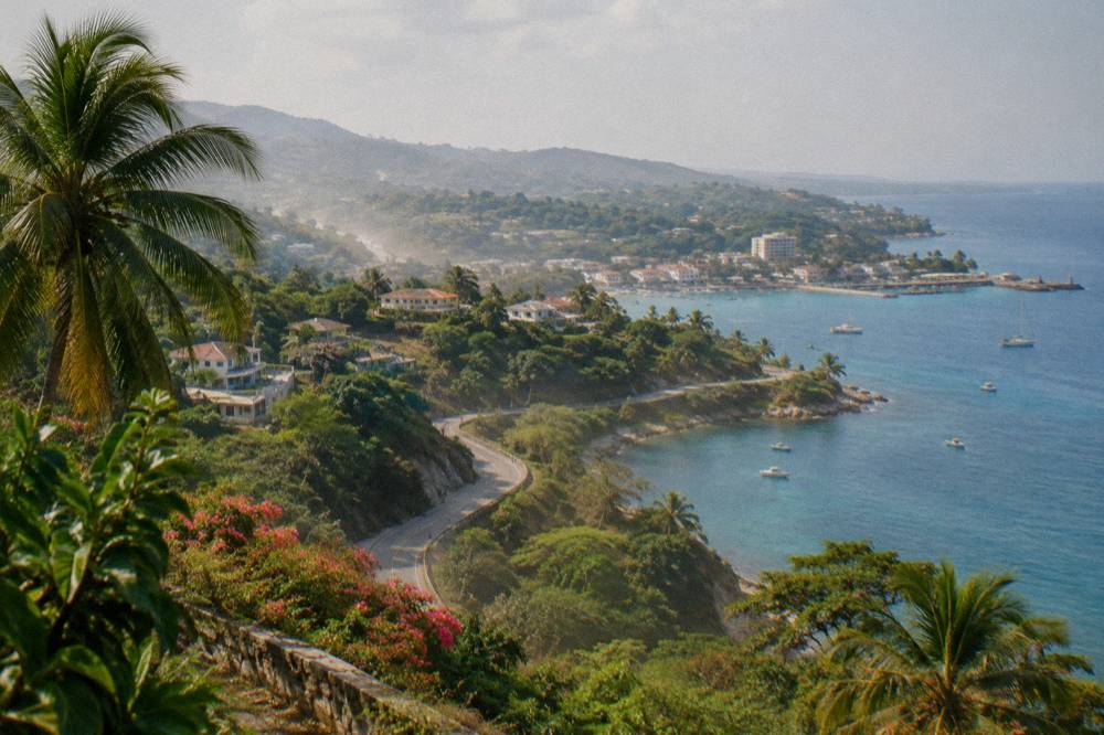 Coastal road winding along the green shoreline near Ocho Rios harbour