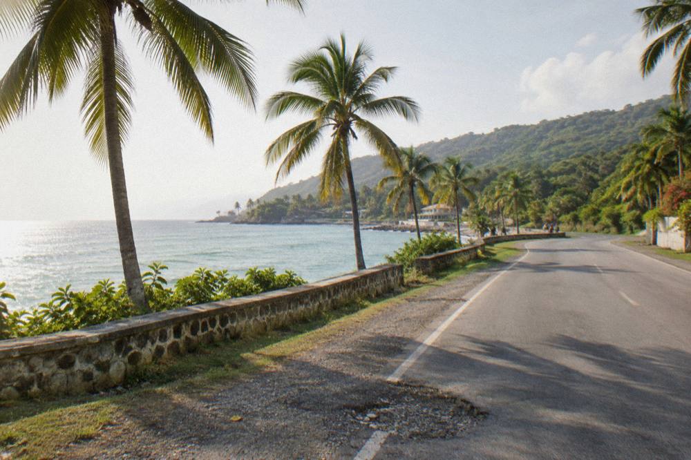 Coastal highway winding along the green shoreline toward Ocho Rios