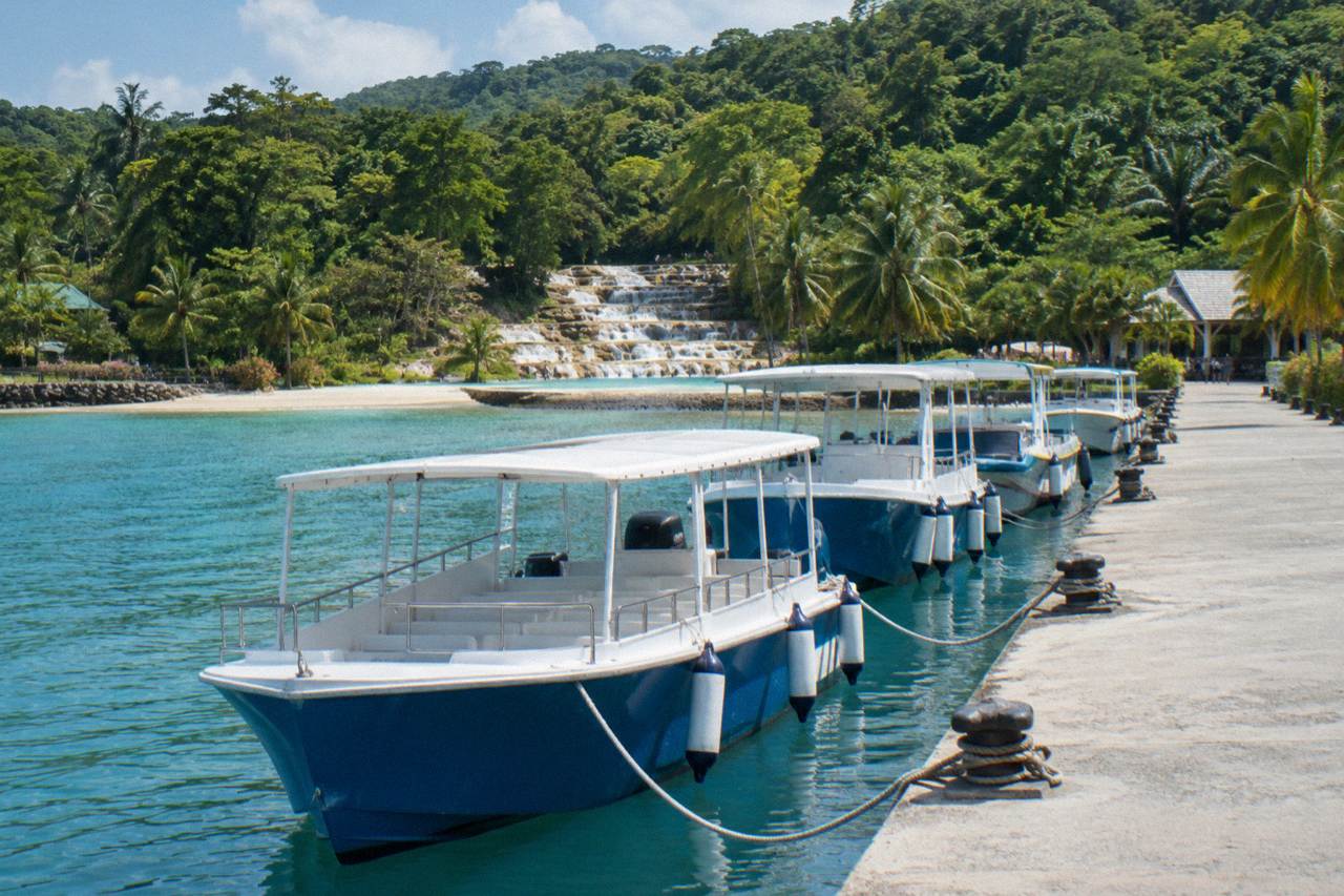 Cruise ship tender pier along the Ocho Rios waterfront with tour boats moored beside the pier